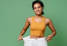 Woman demonstrating weight loss results