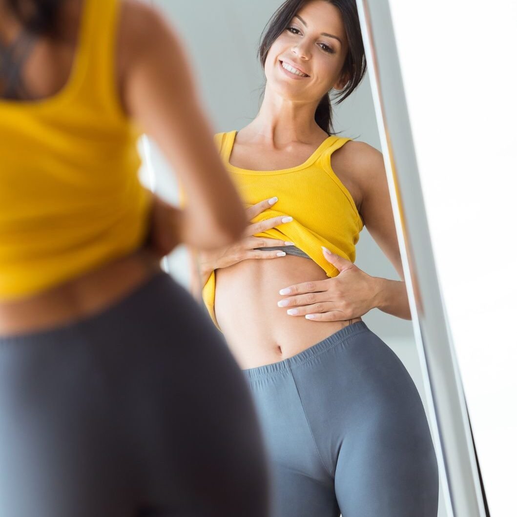 Person using a weekly weight loss injection pen as part of a pharmacist-led weight management programme.