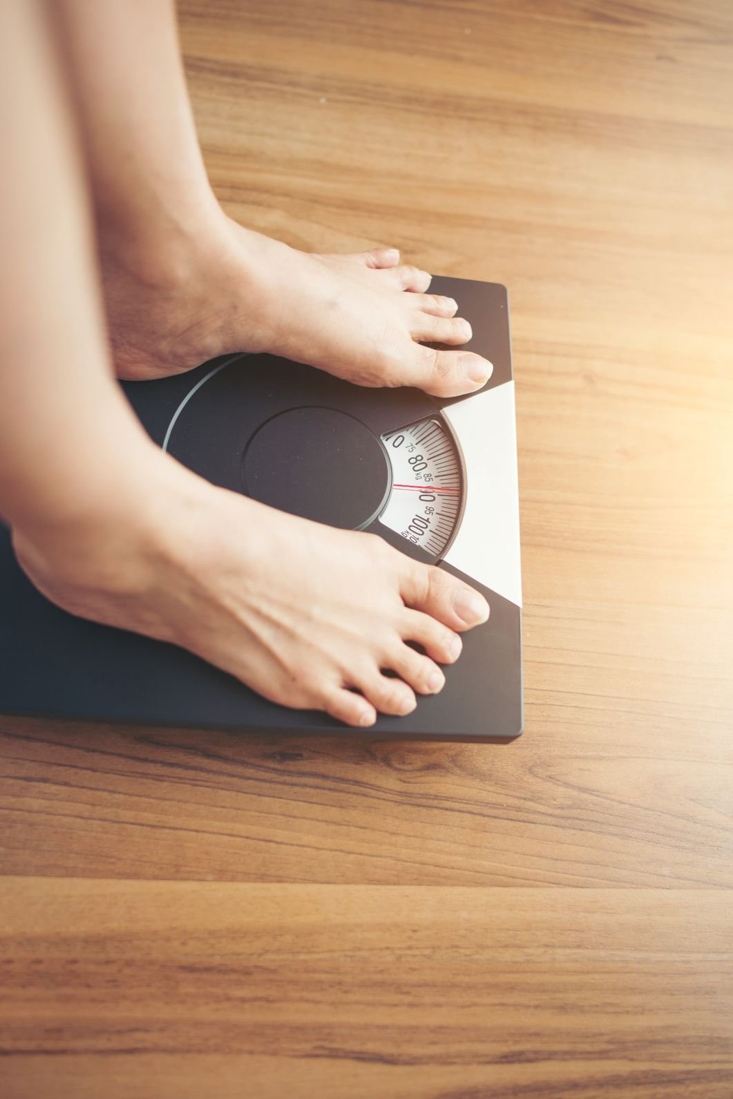 Pharmacist conducting a weight loss assessment before starting treatment.