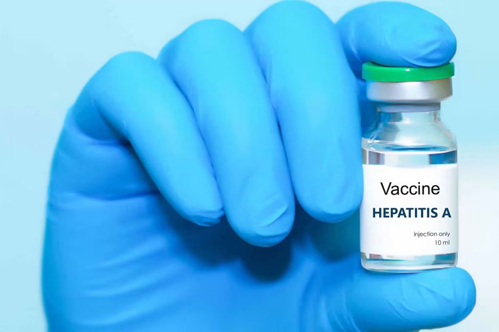bettercare-gloved-hand-holding-vial-of-hepatitis-a-vaccine-hero